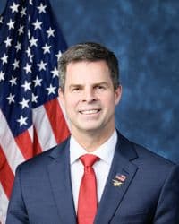 Official portrait of John McGuire